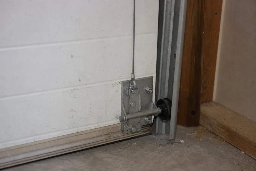 Bottom bracket, lift cable and roller on a garage door in Killeen, TX