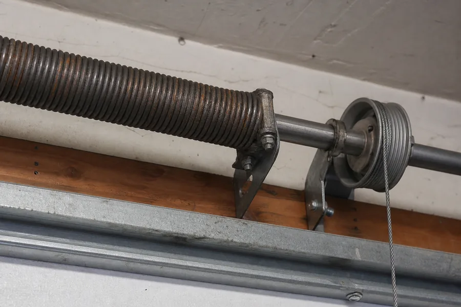 Torsion spring, shaft and cable drum above a garage door in Killeen, TX